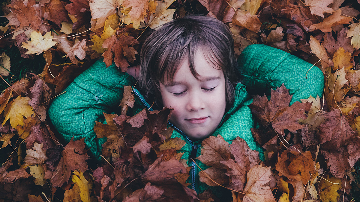 Sleep Problems and Autism, child in leaves