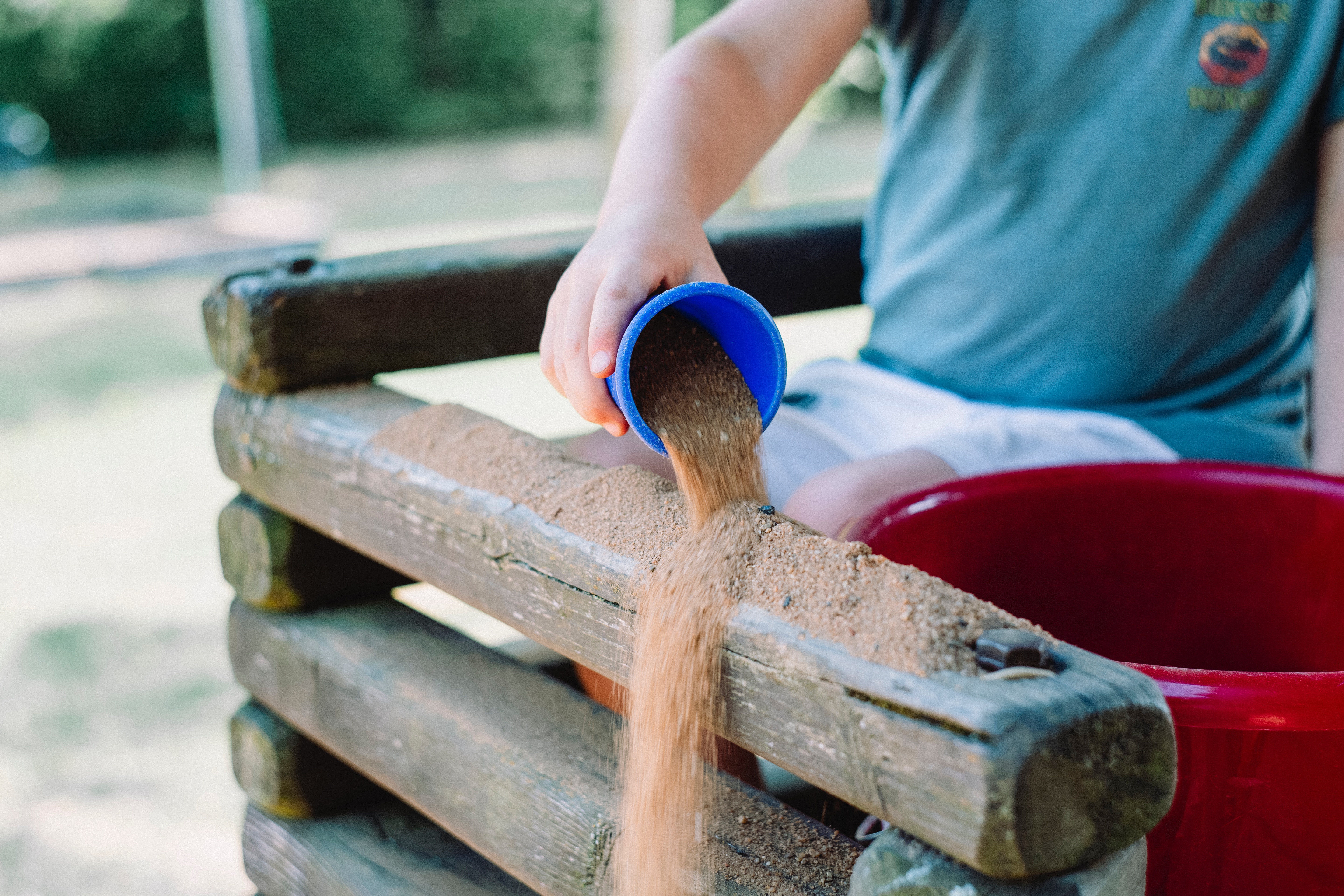 Toddler playing in sand for ABA Occupational Therapy