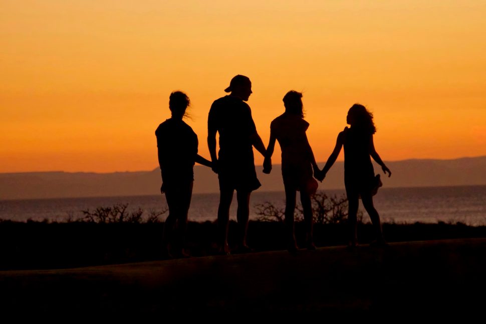 Family Standing on the Beach at Sunset with Sensory Processing Disorder